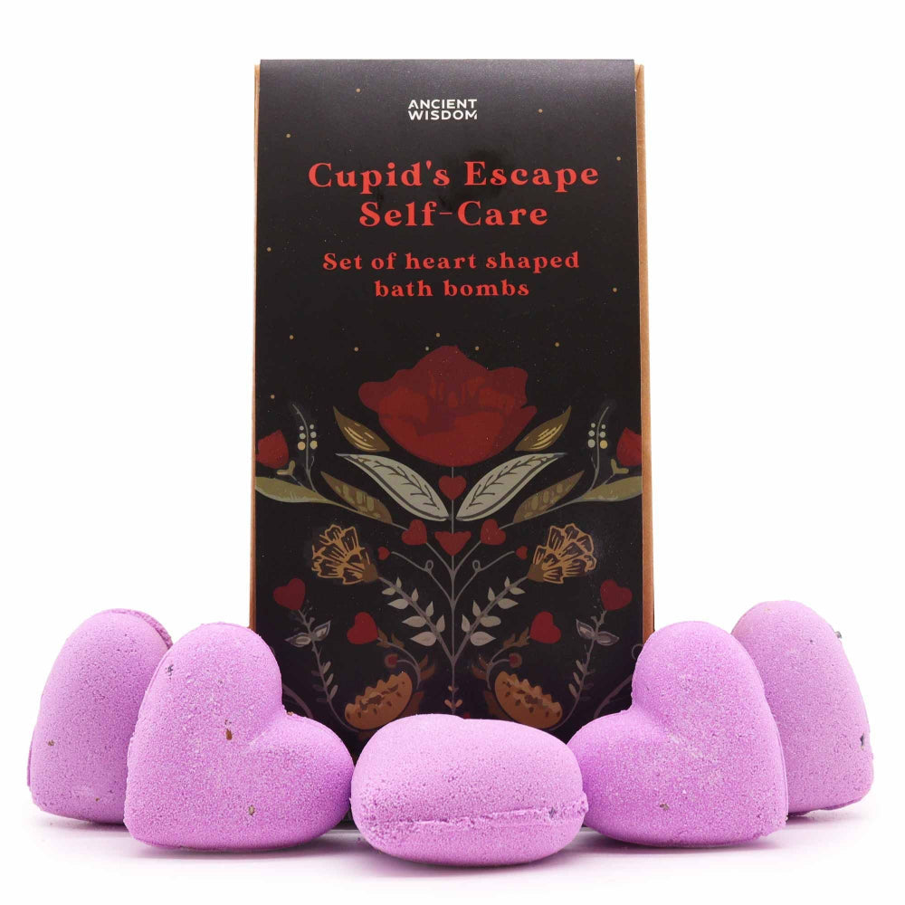Set of heart-shaped purple bath bombs with a decorative box labeled 'Cupid's Escape Self-Care' on a white background.