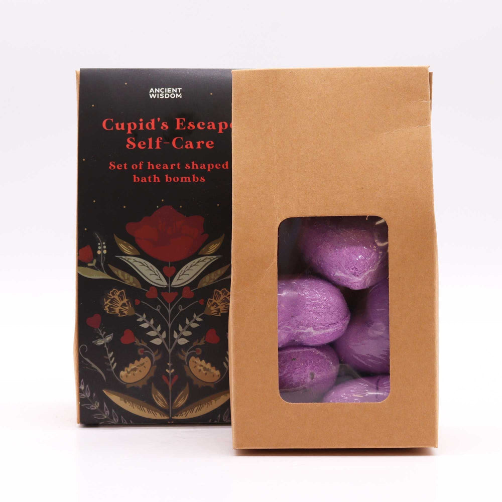 Box of purple heart-shaped bath bombs with decorative packaging on a white background